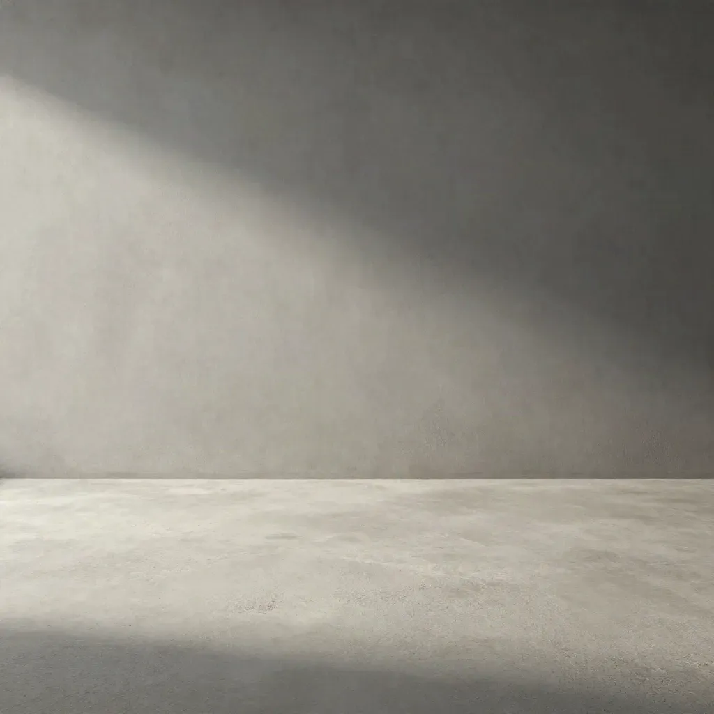 Minimal pale concrete background with soft grey gradient and quiet shadow for pricing copy.